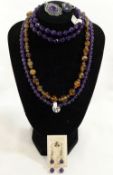 A collection of amethyst and citrine set jewellery, the amethyst jewellery comprised of an