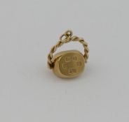 A 9 carat gold pendant in the form of a spinning seal, Birmingham 1992,  bearing inscription, 2.