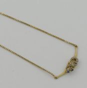A yellow metal necklace with box-link chain and central sapphire and diamond set panel, stamped '