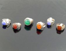Twelve carnelian, chrysoprase and blue agate set rings, including some also set with marcasite, many