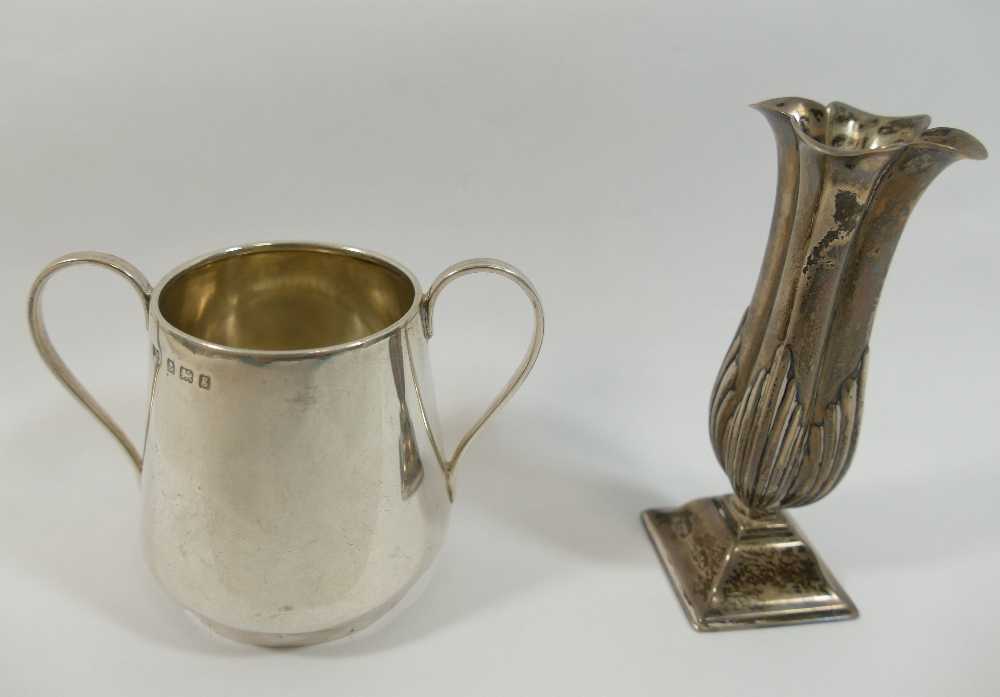 A small late Victorian silver vase, with quatrefoil flared rim, half reeded body and raised on - Image 2 of 2