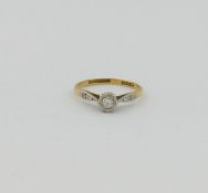 An 18 carat gold diamond single stone ring, the round brilliant cut diamond approximately 0.15