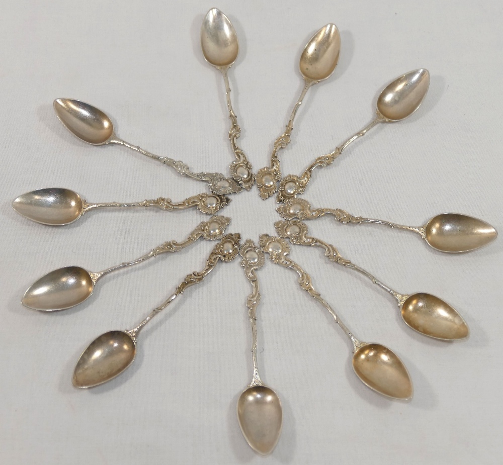 Eleven late 19th/early 20th century German cast silver coffee spoons with ornate Rococo style