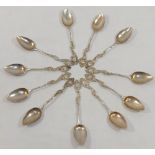 Eleven late 19th/early 20th century German cast silver coffee spoons with ornate Rococo style