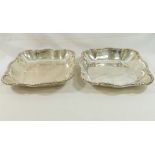 A pair of French silver serving dishes, of lobed cushion-shaped form, cast with ornate rim,