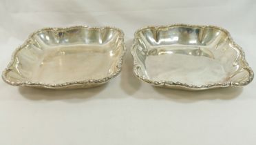 A pair of French silver serving dishes, of lobed cushion-shaped form, cast with ornate rim,