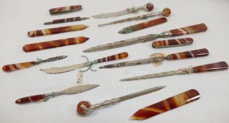 Sixteen banded carnelian and moss agate items including paper knives, button hook, penknives, and