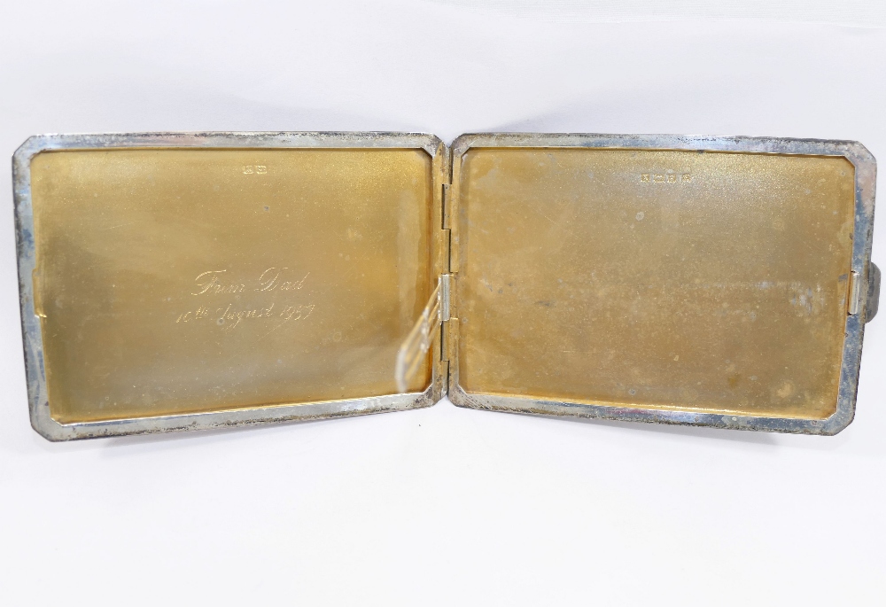 A rectangular silver cigarette case, Birmingham 1922, the lid inlaid with yellow metal bands, 12cm x - Image 3 of 3