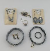 A quantity of hematite jewellery comprised of two bracelets, a beaded necklace, three pairs of