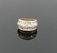 A 14 carat gold diamond set triple band ring, London 2000, maker's mark 'TJ', the outer tapered