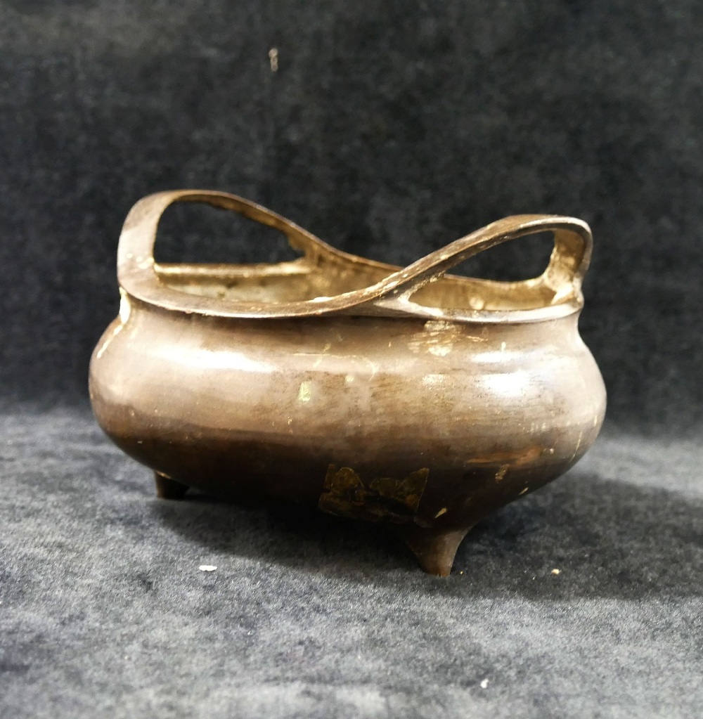 A Chinese Xuande-style bronze two-handled censor/incense burner, raised on three legs  with 16