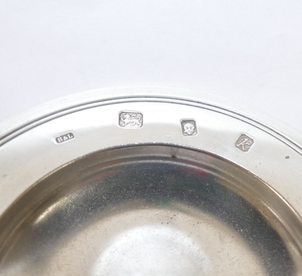 A small silver Tudor style dish, London 1965, 11.4cm diameter, 3.42ozt, 106.4g CONDITION REPORTS & - Image 2 of 2