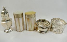 A Victorian silver napkin ring with pierced decoration, another silver napkin ring, and a silver
