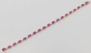 A pink sapphire and diamond line bracelet, the 19 oval mixed cut sapphires, combined weight 10.57