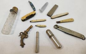 A collection of miscellaneous items comprised of assorted folding penknives, a novelty whistle in