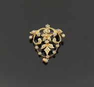 A late Victorian/Edwardian seed pearl set openwork pendant brooch, stamped '15CT', 3.5cm long x 2.