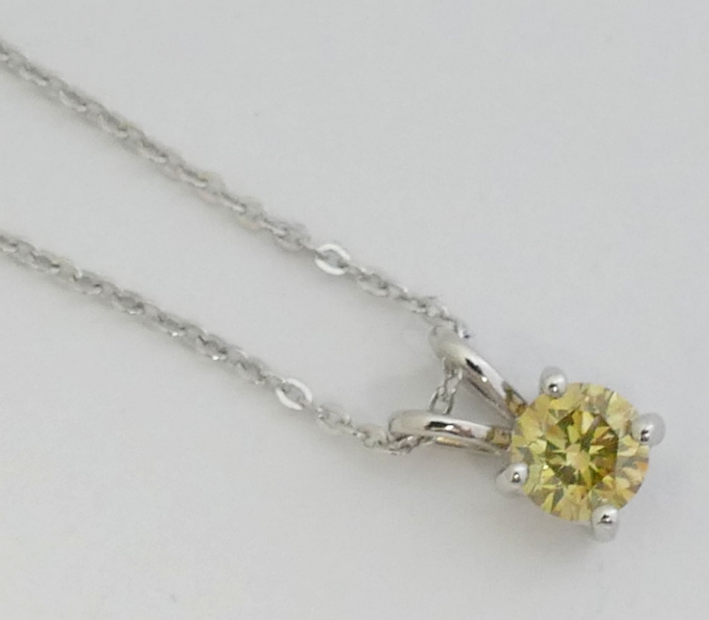 A fancy yellow diamond pendant, the round brilliant cut stone 0.61 carats, VSI clarity, housed in - Image 3 of 5