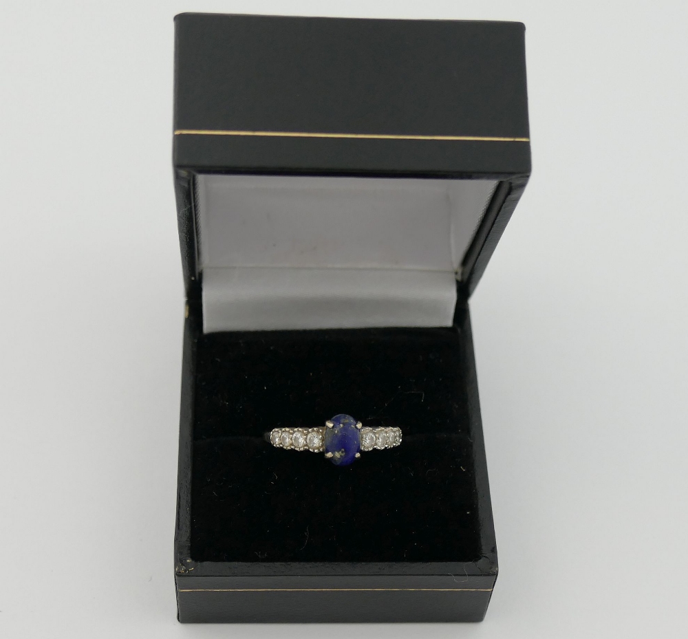 An 18 carat white gold lapis lazuli and diamond ring, the oval lapis lazuli cabochon in four claw - Image 3 of 4