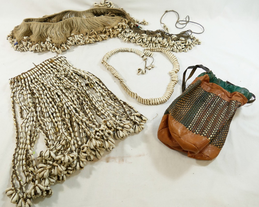 A collection of Cowrie shell decorated tribal items comprised of a headdress, shawl, belts and an - Image 3 of 4