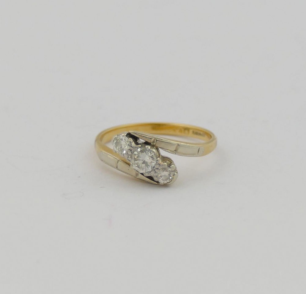 A diamond three-stone cross over ring, the round brilliant cut stones combined weight - Image 2 of 4