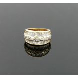 A 14 carat gold diamond set triple band ring, London 2000, maker's mark 'TJ', the outer tapered