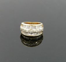 A 14 carat gold diamond set triple band ring, London 2000, maker's mark 'TJ', the outer tapered