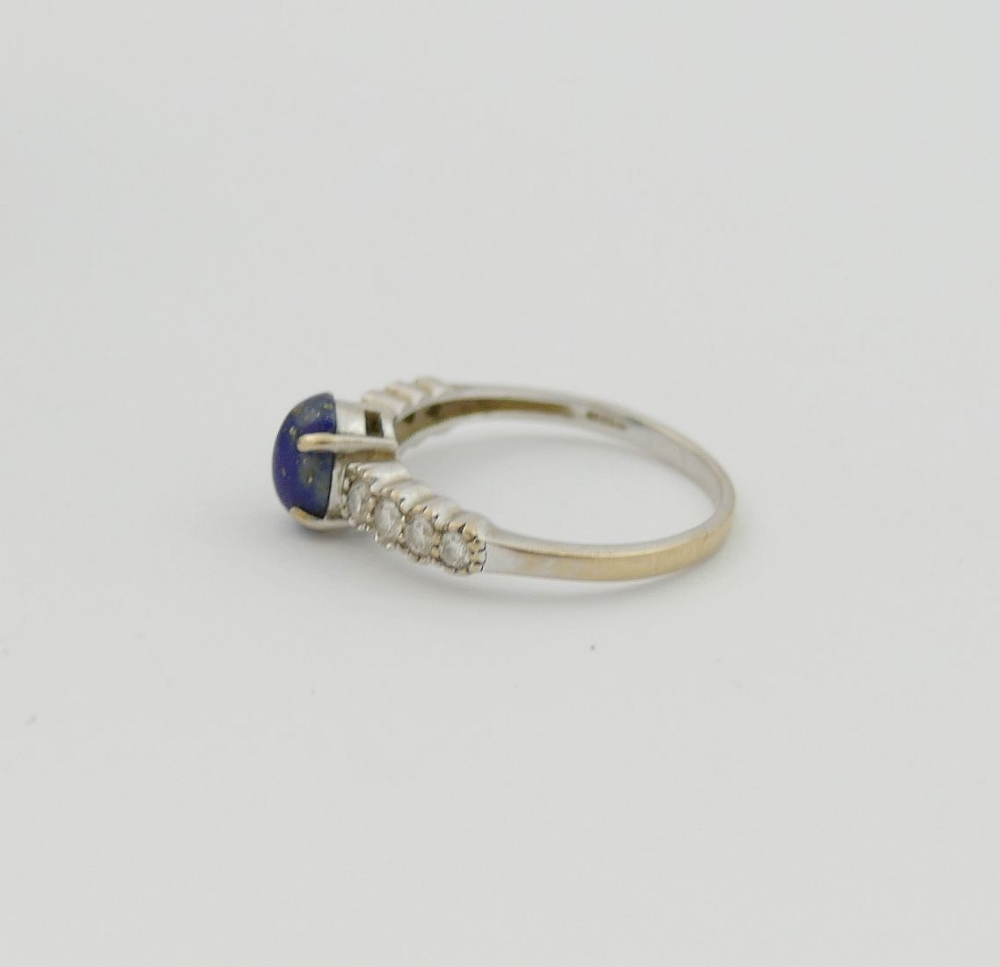 An 18 carat white gold lapis lazuli and diamond ring, the oval lapis lazuli cabochon in four claw - Image 4 of 4