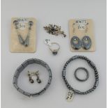 A quantity of hematite jewellery comprised of two bracelets, a beaded necklace, three pairs of