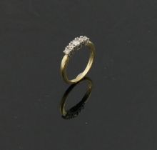 A 9 carat gold diamond five-stone ring, the five graduated round mixed cut diamonds combined