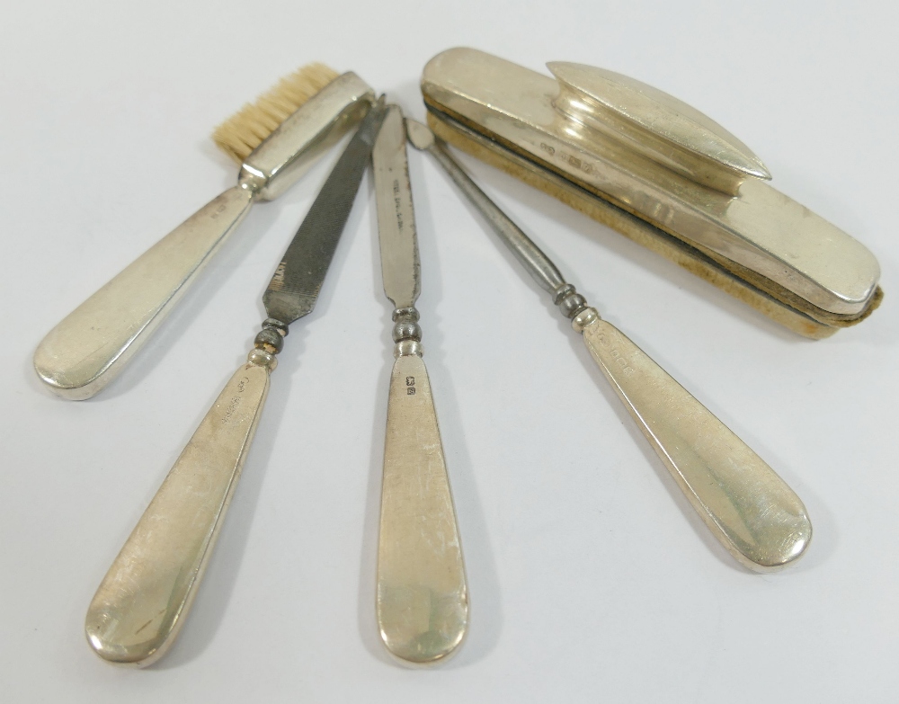 A silver handled five-piece manicure set including a nail buffer, and brush, Birmingham 1949 - Image 2 of 2