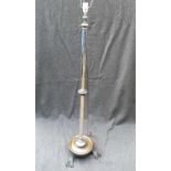 A silver plated telescopic standard lamp, on circular base raised on three claw feet, fully extended