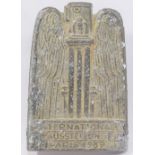 A cast aluminium 1937 Paris International Exposition of Art and Technology in Modern Life badge