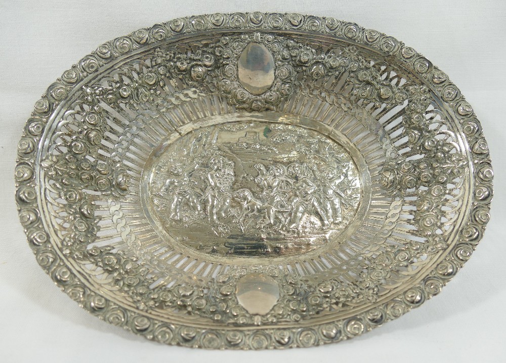 A 19th century German silver basket, the pierced sides embossed with floral swags and oval