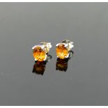 A pair of single stone oval mixed cut citrine stud earrings, the stones 7.8mm x 5.9mm, housed in