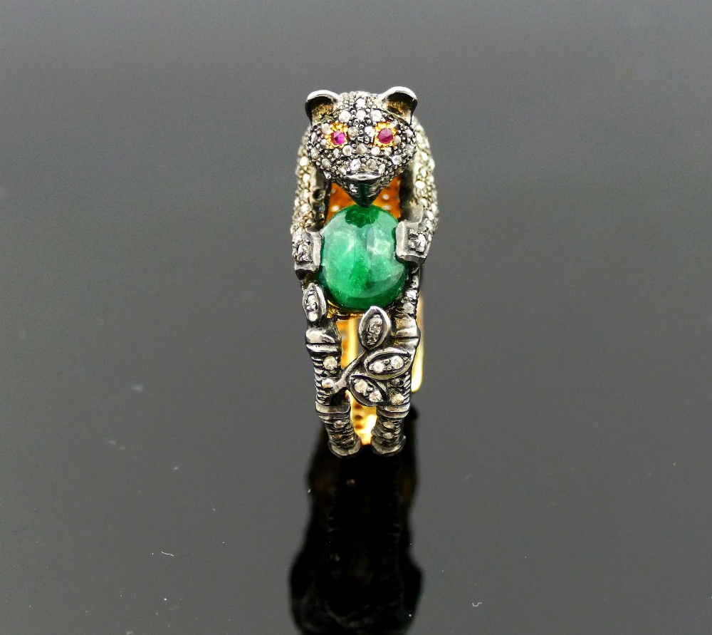 An emerald and diamond dress ring in the form of a cat with ruby eyes holding a ball in the form - Image 2 of 3