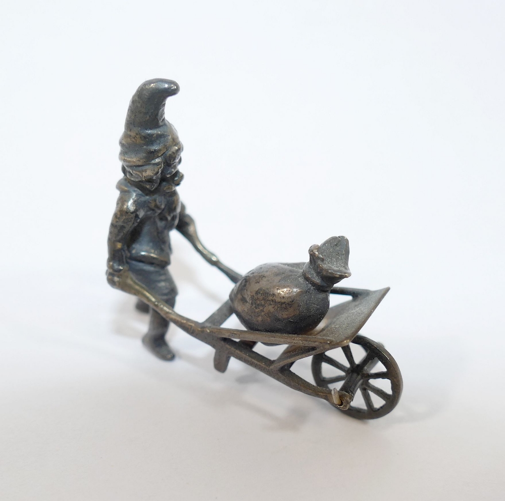 A late 19th century German Neresheimer silver figure of a gnome pushing a wheelbarrow containing a - Image 2 of 4