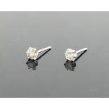 A pair of diamond stud earrings, the round brilliant cut stones, each approximately 0.10 carats,