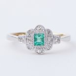 An 18ct yellow gold & platinum Art Deco ring set with a central step cut emerald, approx. 0.27