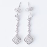A pair of 18ct white gold drop earrings set with small round brilliant cut diamonds, total diamond