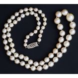 A string of cultured pearls, sizes ranging from 5mm to 10mm, length 20", 9ct white gold diamond