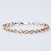 A 9ct yellow gold circular link bracelet set with small round tanzanite, length 18cm, 5.33gm.