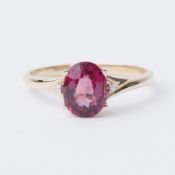 A 9ct yellow gold ring set with a 2.45 carat Comeria Garnet (pink purple hues) set to each