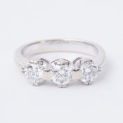 An 18ct white gold ring set with three round brilliant cut diamonds, total diamond weight approx.