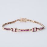 A 9ct yellow gold line bracelet set with square cut rubies and small round brilliant cut diamonds,