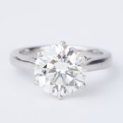 An impressive platinum six claw solitaire ring set with a round brilliant cut diamond,