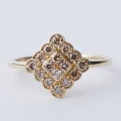 A 9ct yellow gold ring set with a total of 0.50 carats of round brilliant cut champagne Argyle