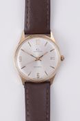 Garrard, a gents 9ct cased yellow gold automatic date wristwatch with 1/4 arabic/baton silver