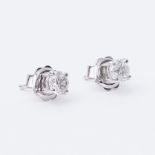 A pair of 18ct white gold stud earrings set with approx. 0.74 carats of round brilliant cut diamonds