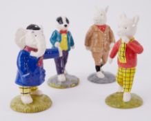 A set of four Beswick Rupert Bear figurines comprising Rupert Bear, Edward Trunk, Bill Badger and