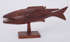 A carved model of a fish from Pitcairn Island (damaged fin), length 34cm.